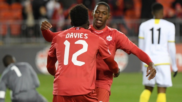 Jonathan David and Alphonso Davies, The Canadian Press Jonathan David and Alphonso Davies