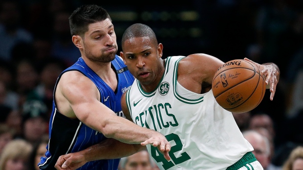 Nikola Vucevic and Al Horford , The Canadian Press Nikola Vucevic and Al Horford