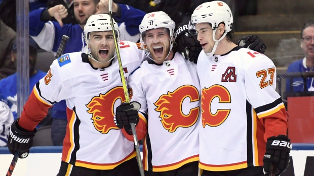 Elias Lindholm Mark Giordano Sean Monahan, The Canadian Press Elias Lindholm Mark Giordano Sean Monahan
