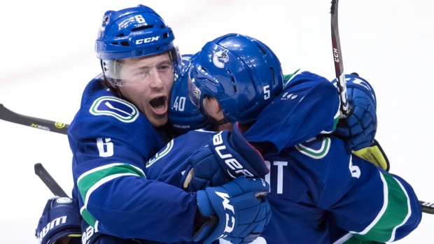 Vancouver Canucks celebrate, The Canadian Press Vancouver Canucks celebrate