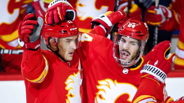 Mikael Backlund Travis Hamonic, The Canadian Press Mikael Backlund Travis Hamonic