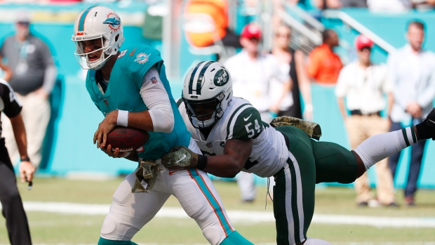Brock Osweiler sacked by Avery Williamson, The Canadian Press Brock Osweiler sacked by Avery Williamson