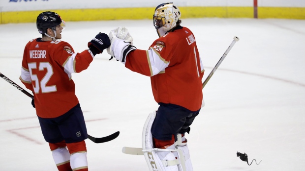 Roberto Luongo and MacKenzie Weegar