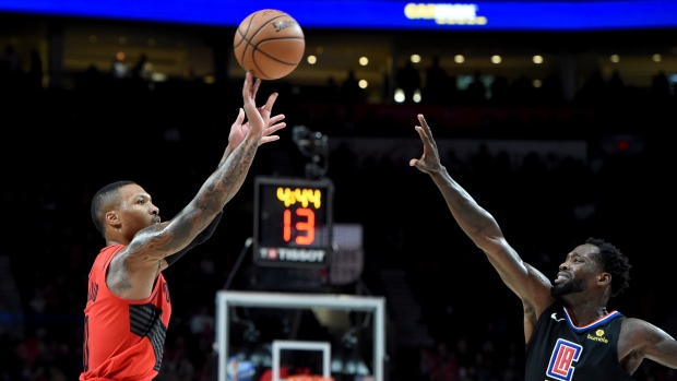 Damian Lillard and Patrick Beverley, The Canadian Press Damian Lillard and Patrick Beverley