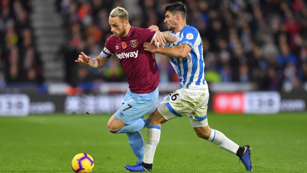 West Ham United's Marko Arnautovic, left, and Huddersfield Town's Christopher Schindler, The Canadian Press West Ham United's Marko Arnautovic, left, and Huddersfield Town's Christopher Schindler