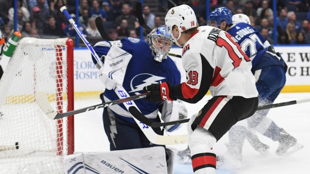 Ryan Dzingel and Andrei Vasilevskiy, The Canadian Press Ryan Dzingel and Andrei Vasilevskiy