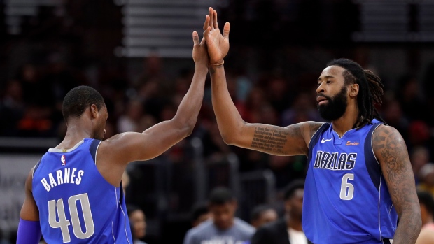 Dallas Mavericks center DeAndre Jordan, right, celebrates with forward Harrison Barnes, The Canadian Press Dallas Mavericks center DeAndre Jordan, right, celebrates with forward Harrison Barnes