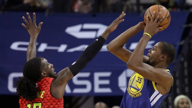 Kevin Durant and Taurean Prince , The Canadian Press Kevin Durant and Taurean Prince
