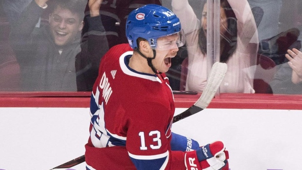 Montreal Canadiens left wing Max Domi (13) celebrates a goal by