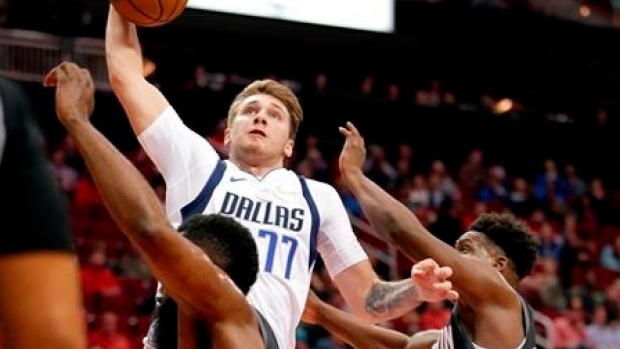 Doncic helps Mavs rout Rockets 128-108 Article Image 0