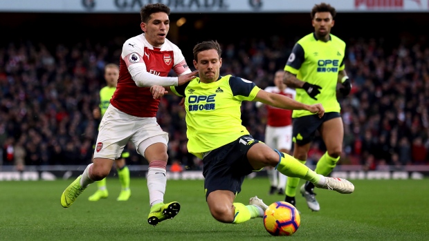 Arsenal's Lucas Torreira and Huddersfield Town's Chris Lowe