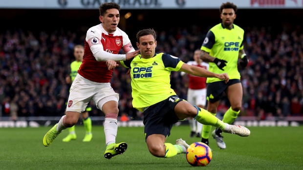 Arsenal's Lucas Torreira and Huddersfield Town's Chris Lowe, The Canadian Press Arsenal's Lucas Torreira and Huddersfield Town's Chris Lowe