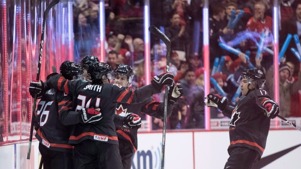 Team Canada celebrates, The Canadian Press Team Canada celebrates