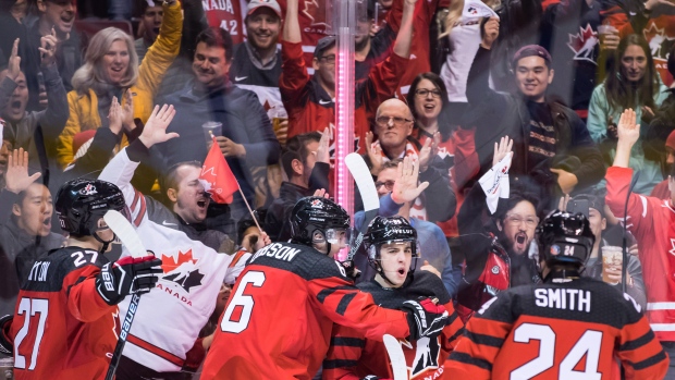 Team Canada celebrates a goal against Denmark., The Canadian Press Team Canada celebrates a goal against Denmark.
