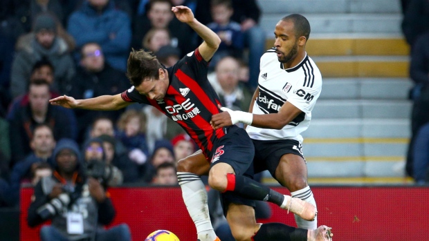 Huddersfield Town's Chris Lowe, left, and Fulham's Denis Odoi, The Canadian Press Huddersfield Town's Chris Lowe, left, and Fulham's Denis Odoi