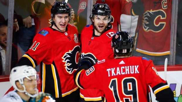 Matthew Tkachuk, Johnny Gaudreau and Sean Monahan of the Calgary