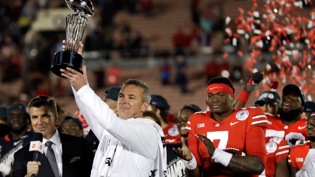 Urban Meyer with Rose Bowl trophy, The Canadian Press Urban Meyer with Rose Bowl trophy