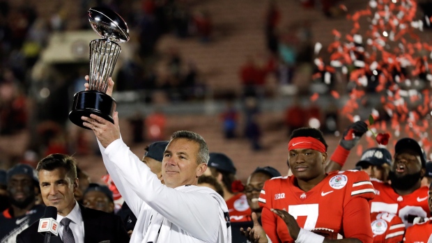 Urban Meyer with Rose Bowl trophy, The Canadian Press Urban Meyer with Rose Bowl trophy