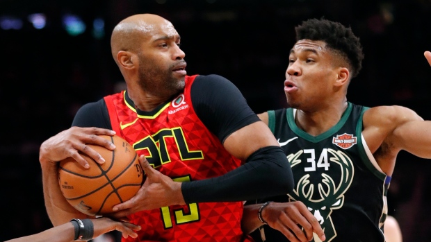 Giannis Antetokounmpo and Vince Carter , The Canadian Press Giannis Antetokounmpo and Vince Carter