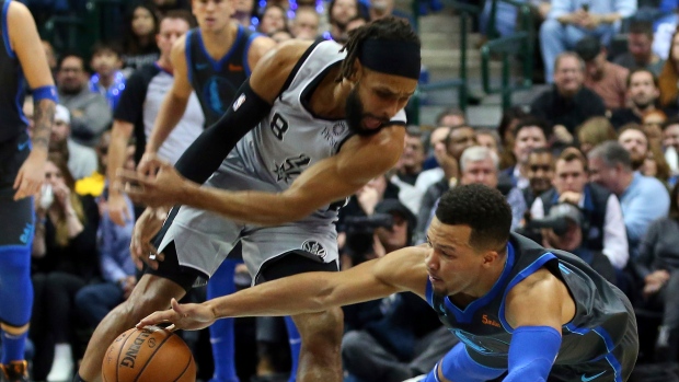 Patty Mills and Jalen Brunson , The Canadian Press Patty Mills and Jalen Brunson