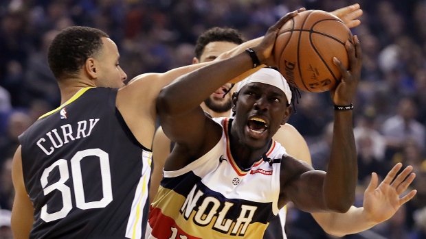 Stephen Curry and Jrue Holiday, The Canadian Press Stephen Curry and Jrue Holiday