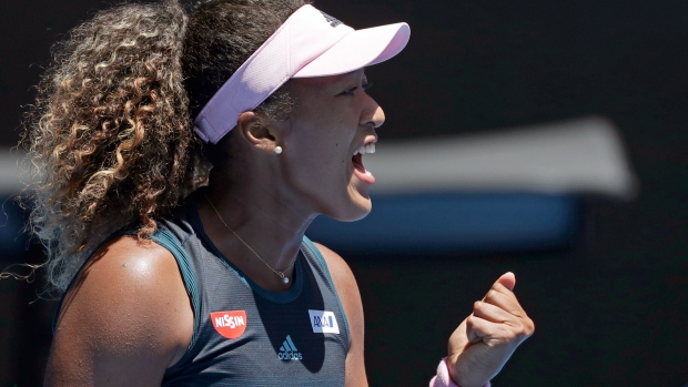 Naomi Osaka celebrates