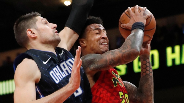 Nikola Vucevic John Collins, The Canadian Press Nikola Vucevic John Collins