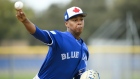 Elvis Luciano pitches during spring training in Dunedin, Fla.