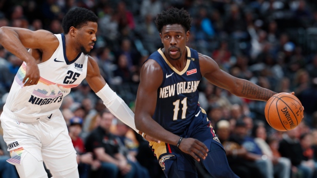 Jrue Holiday aand Malik Beasley, The Canadian Press Jrue Holiday aand Malik Beasley
