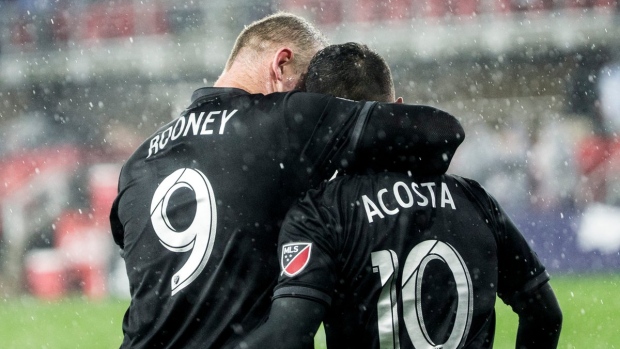 Wayne Rooney and Luciano Acosta