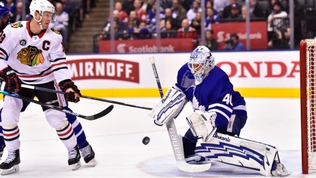 Garret Sparks makes a save as Jonathan Toews looks for a rebound on Wednesday.