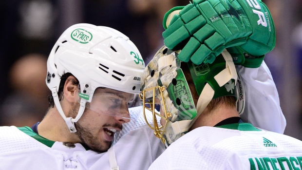 Auston Matthews celebrates Friday's win with Frederik Andersen.