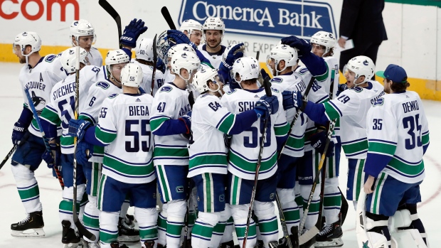 Vancouver Canucks celebrate, The Canadian Press Vancouver Canucks celebrate