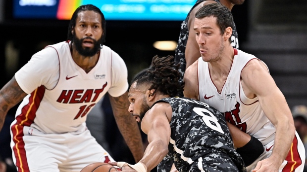 Patty Mills, Goran Dragic and James Johnson, The Canadian Press Patty Mills, Goran Dragic and James Johnson