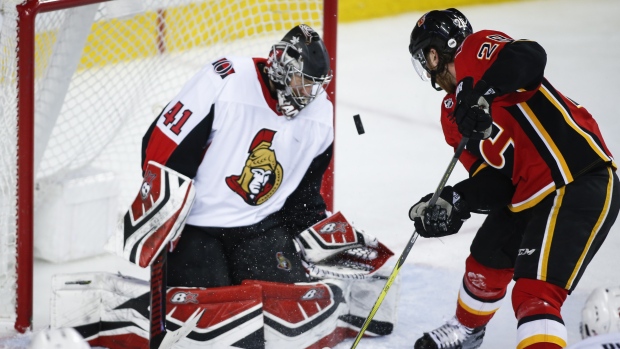 Craig Anderson and Elias Lindholm , The Canadian Press Craig Anderson and Elias Lindholm