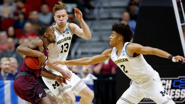 Sayeed Pridgett and Michigan's Ignas Brazdeikis, The Canadian Press Sayeed Pridgett and Michigan's Ignas Brazdeikis