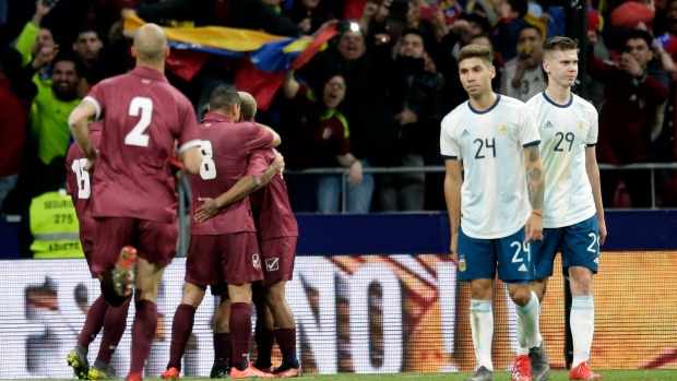 Venezuela celebrates in game versus Argentina , The Canadian Press Venezuela celebrates in game versus Argentina