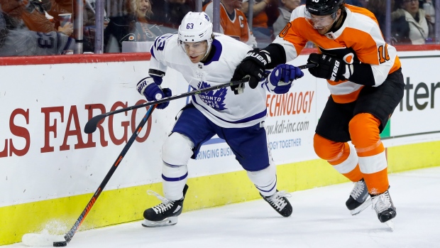 Leafs forward Tyler Ennis battles Flyers' Corban Knight on Wednesday.