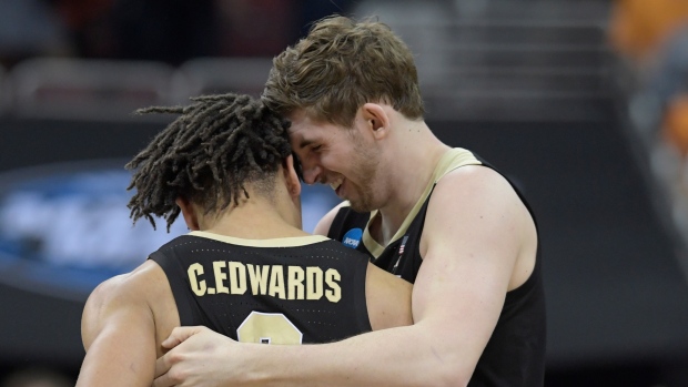 Purdue's Ryan Cline, right and Carsen Edwards 