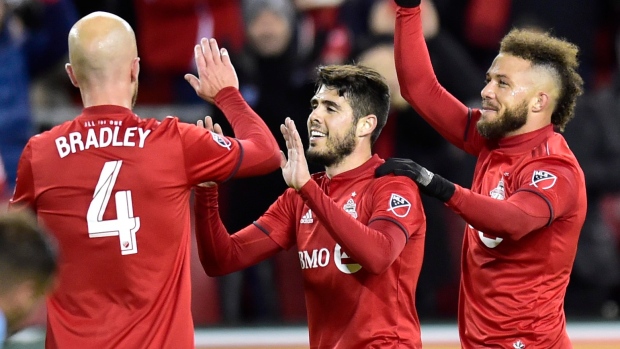 Alejandro Pozuelo with Michael Bradley and Nick DeLeon