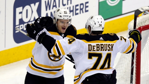 Karson Kuhlman and Jake DeBrusk , The Canadian Press Karson Kuhlman and Jake DeBrusk