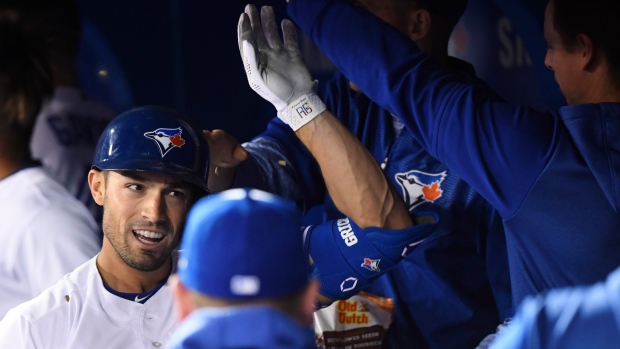 Randal Grichuk celebrates his home run on Monday.