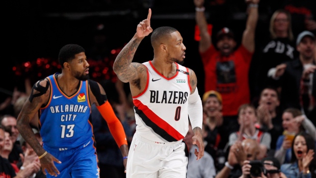 Damian Lillard and Paul George , The Canadian Press Damian Lillard and Paul George