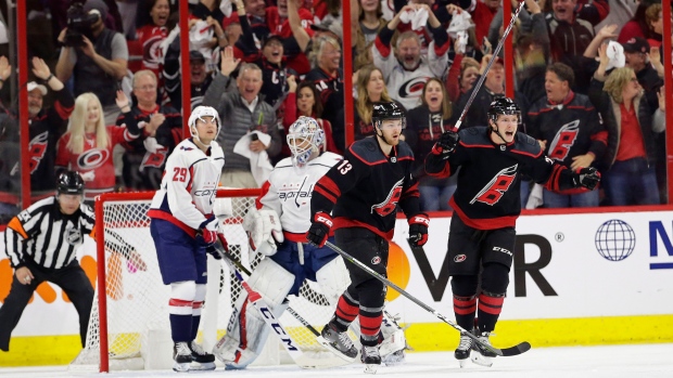 Carolina Hurricanes' Warren Foegele (13) and Brock McGinn celebrate 