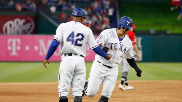 Texas Rangers third base coach Tony Beasley, left, congratulates Shin-Soo Choo, The Canadian Press Texas Rangers third base coach Tony Beasley, left, congratulates Shin-Soo Choo
