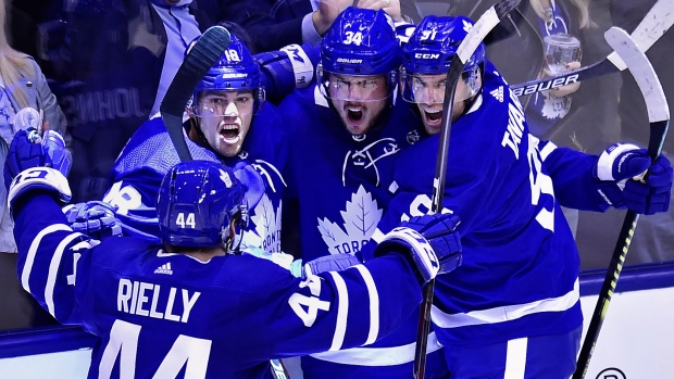 Auston Matthews celebrates his goal with his teammates Monday.