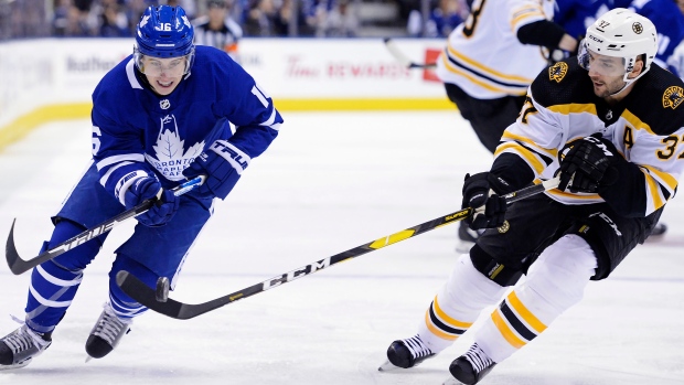 Mitch Marner and Patrice Bergeron battle on Monday night.