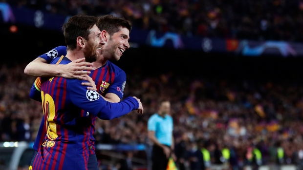 Lionel Messi, front, celebrates with Barcelona midfielder Sergi Roberto , The Canadian Press Lionel Messi, front, celebrates with Barcelona midfielder Sergi Roberto