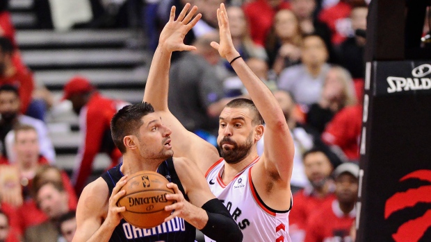 Raptors centre Marc Gasol defends against Magic centre Nikola Vucevic., The Canadian Press Raptors centre Marc Gasol defends against Magic centre Nikola Vucevic.