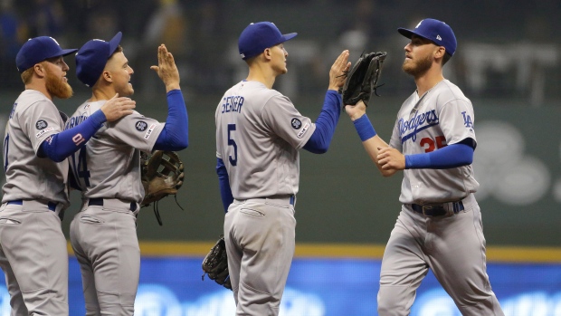 Cody Bellinger, and teammates celebrate, The Canadian Press Cody Bellinger, and teammates celebrate